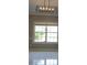 Living room with window. White tile floor and grey walls at 15 Muirfield Village Ct, Summerville, SC 29483