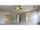 Bright main bedroom featuring neutral paint, plush carpeting, generous closet space, and an ensuite bathroom at 15 Muirfield Village Ct, Summerville, SC 29483
