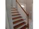 Bright entryway with white staircase with wood railings and white door to the left at 15 Muirfield Village Ct, Summerville, SC 29483