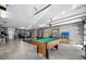 Finished basement features a pool table and ample space for entertainment, complemented by durable concrete floors at 1624 Prince Edward St, Mount Pleasant, SC 29466