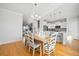 Inviting dining area boasts wood floors and plenty of light for Gathering meals and gatherings at 1624 Prince Edward St, Mount Pleasant, SC 29466