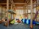 Interior view of a wooden storage building with various kayaks and recreational equipment at 1624 Prince Edward St, Mount Pleasant, SC 29466
