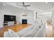 Open-concept living room with fireplace, hardwood floors, and a neutral color palette at 1624 Prince Edward St, Mount Pleasant, SC 29466