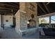 Cozy outdoor fireplace with brick surround and ample seating, perfect for gatherings and relaxation at 1624 Prince Edward St, Mount Pleasant, SC 29466