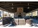Inviting outdoor lounge area featuring comfortable seating, a fireplace, and a covered patio at 1624 Prince Edward St, Mount Pleasant, SC 29466