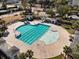 Aerial view of a large pool and sunbathing area with palm trees in a lovely community at 1624 Prince Edward St, Mount Pleasant, SC 29466