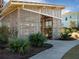 Exterior view of a slat-sided storage building with visible equipment through the slats and lush landscaping at 1624 Prince Edward St, Mount Pleasant, SC 29466