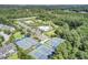 Aerial view featuring tennis courts, community pool, clubhouse, and surrounding greenery at 1634 Pin Oak Cut, Mount Pleasant, SC 29466
