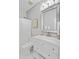 Bright bathroom featuring a toilet, white vanity, decorative mirror and chrome fixtures at 1634 Pin Oak Cut, Mount Pleasant, SC 29466