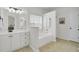 Clean bathroom with a tub, neutral color palette, vanity, and a window for natural light at 1634 Pin Oak Cut, Mount Pleasant, SC 29466