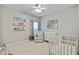 Charming baby room featuring neutral walls, white crib and comfortable furniture at 1634 Pin Oak Cut, Mount Pleasant, SC 29466