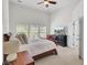 Bright bedroom featuring a king-size bed, dresser, and ample natural light from large windows at 1634 Pin Oak Cut, Mount Pleasant, SC 29466