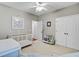 Charming baby room featuring neutral walls, white crib and comfortable furniture at 1634 Pin Oak Cut, Mount Pleasant, SC 29466