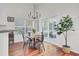 Bright dining area with a chandelier and sliding glass doors to the backyard at 1634 Pin Oak Cut, Mount Pleasant, SC 29466