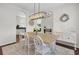 Dining room with natural wood table, seating for eight, and stylish decor at 1634 Pin Oak Cut, Mount Pleasant, SC 29466
