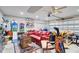 Organized garage featuring a sitting area and storage shelves at 1634 Pin Oak Cut, Mount Pleasant, SC 29466