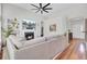 Cozy living room with a fireplace, built-in shelves, and hardwood floors at 1634 Pin Oak Cut, Mount Pleasant, SC 29466