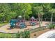 Community playground featuring climbing wall and multiple play structures with a wood chip surface at 1634 Pin Oak Cut, Mount Pleasant, SC 29466