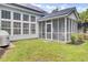 Home's screened porch provides a perfect transition from indoor living to a beautiful backyard at 1634 Pin Oak Cut, Mount Pleasant, SC 29466