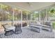 Inviting screened porch with stylish furniture and a cozy outdoor living space at 1634 Pin Oak Cut, Mount Pleasant, SC 29466