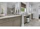 Bright bathroom featuring granite countertops, double sinks, and a decorative orchid at 1658 Pierce St, Charleston, SC 29492
