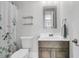 Bathroom with a floral shower curtain, a modern mirror and sink, and gray and white color palette at 1658 Pierce St, Charleston, SC 29492