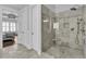 Tiled shower with glass surround is adjacent to the Primary bedroom at 1658 Pierce St, Charleston, SC 29492
