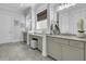 Bright bathroom with granite countertops, double sinks, and stylish fixtures at 1658 Pierce St, Charleston, SC 29492