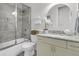 Well-lit bathroom with granite counters, modern fixtures, and a shower-tub combo at 1658 Pierce St, Charleston, SC 29492