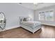 Bedroom with hardwood floors, bright window and comfortable bed with storage underneath at 1658 Pierce St, Charleston, SC 29492