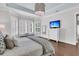 Spacious bedroom with hardwood floors, plantation shutters, and cozy decor at 1658 Pierce St, Charleston, SC 29492
