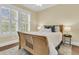 Cozy bedroom boasts bright windows, hardwood floors and neutral color palette at 1658 Pierce St, Charleston, SC 29492