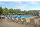 Inviting community pool area with lounge chairs and colorful pennants, ideal for relaxation and recreation at 1658 Pierce St, Charleston, SC 29492