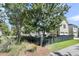 Traditional home with a fenced yard, mature landscaping, and two-car garage at 1658 Pierce St, Charleston, SC 29492