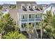 Charming two-story home featuring a spacious double porch and well-maintained landscaping at 1658 Pierce St, Charleston, SC 29492