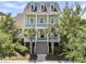 Inviting two-story home with a double porch, perfect for enjoying the outdoors at 1658 Pierce St, Charleston, SC 29492