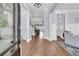 Open foyer featuring hardwood floors, soft colors, and a view of the living spaces at 1658 Pierce St, Charleston, SC 29492
