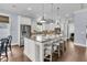 Open kitchen with a large center island with barstool seating and modern appliances at 1658 Pierce St, Charleston, SC 29492
