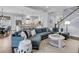 Spacious living room with comfortable blue sectional and an open view into the kitchen at 1658 Pierce St, Charleston, SC 29492