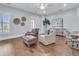 Bright living room featuring hardwood floors, neutral walls, and comfortable seating area at 1658 Pierce St, Charleston, SC 29492