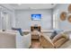Living room with hardwood floors, comfortable seating, and mounted TV with beach scene at 1658 Pierce St, Charleston, SC 29492