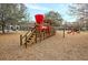 A community playground features a red wooden train with stairs and play equipment at 1658 Pierce St, Charleston, SC 29492