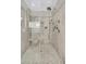 Tile shower featuring a shower seat, multiple shower heads, and a tiled niche at 1658 Pierce St, Charleston, SC 29492