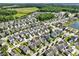 Picturesque aerial view showcases a community surrounded by lush greenery and serene lakes at 1722 Winfield Way, Charleston, SC 29414