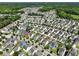 An elevated view of a residential community with a mix of home styles and mature landscaping at 1722 Winfield Way, Charleston, SC 29414
