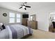 This spacious bedroom is equipped with a flat-screen TV and an ample amount of storage in matching wood at 1722 Winfield Way, Charleston, SC 29414