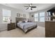 Cozy bedroom features a ceiling fan, neutral walls, and a neatly made bed with matching nightstands at 1722 Winfield Way, Charleston, SC 29414