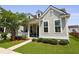 Charming home featuring a cozy porch and gray siding, set in a well-maintained landscape at 1722 Winfield Way, Charleston, SC 29414