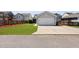 A view of the two-car detached garage from the street with landscaping in the background at 1722 Winfield Way, Charleston, SC 29414