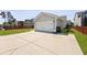 A close-up of the detached garage showcasing the driveway and partial landscaping at 1722 Winfield Way, Charleston, SC 29414